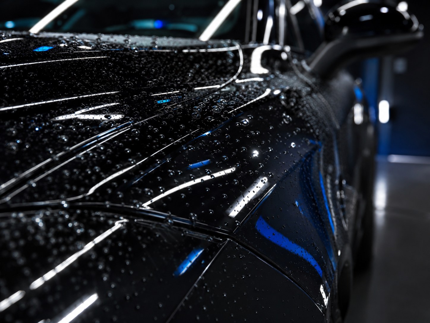 Close-up of water droplets on glossy paint
